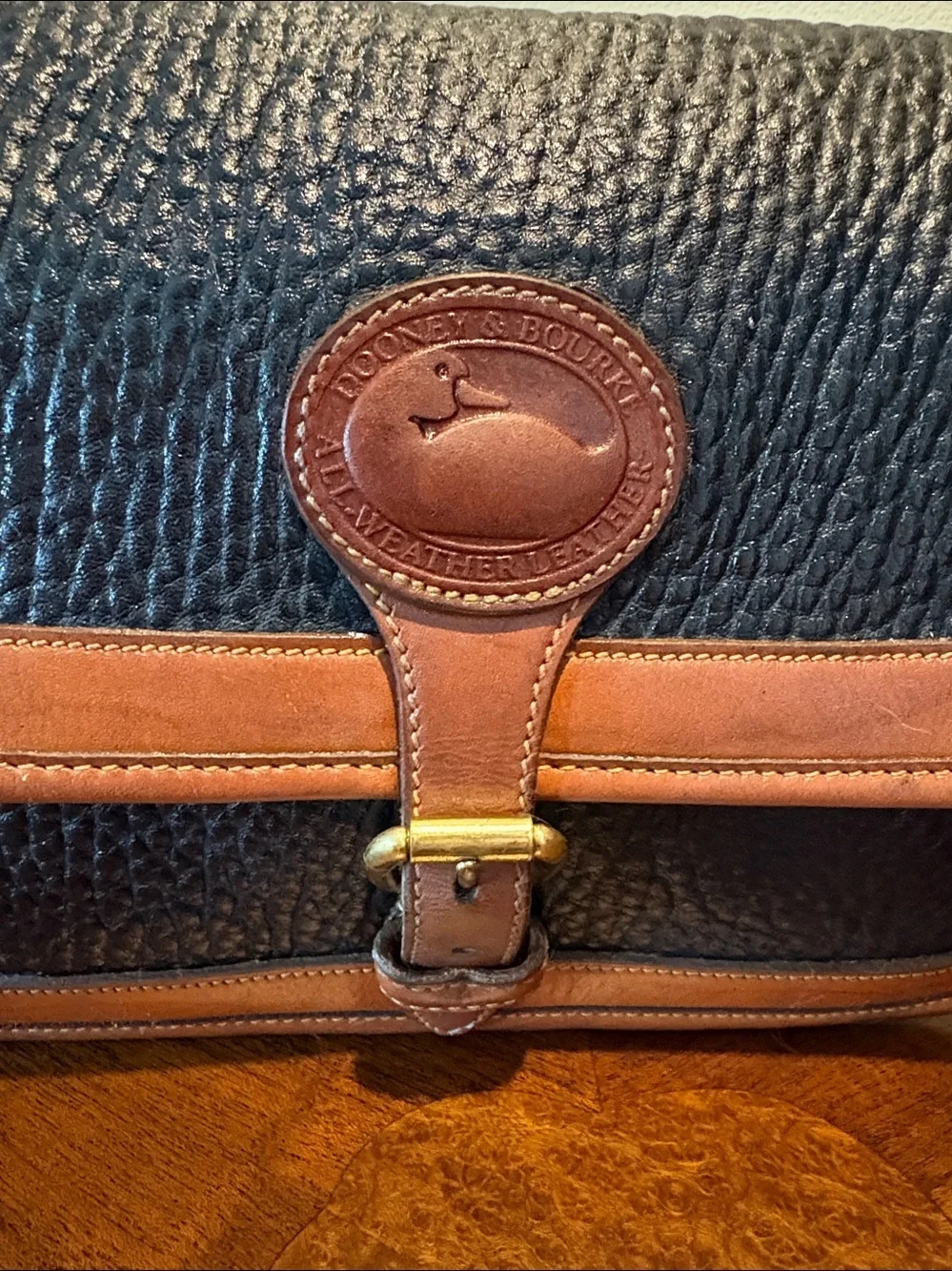Dooney & Bourke All weather Leather Crossbody bag thick leather black/brown EUC